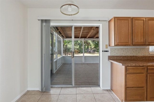 1404 Dartmouth Dr, Bradenton, FL 34207 - doorway featuring light tile patterned floors and baseboards