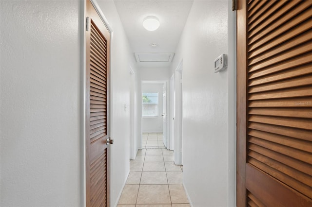 1404 Dartmouth Dr, Bradenton, FL 34207 - corridor with light tile patterned flooring and attic access