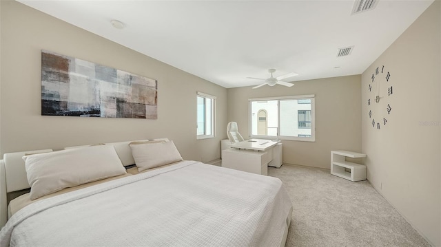 350 Golden Gate Pt Unit 61, Sarasota, FL 34236 - bedroom with light colored carpet and a ceiling fan