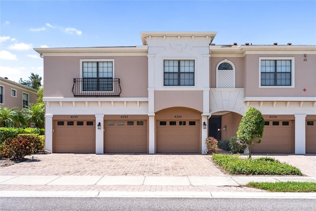 4235 Overture Cir Unit 4235, Bradenton, FL 34209 - view of front of home with an attached garage, driveway, and stucco siding