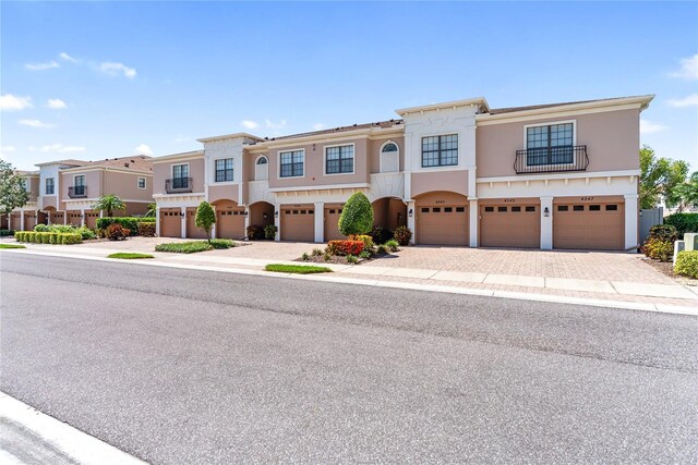 4235 Overture Cir Unit 4235, Bradenton, FL 34209 - view of front of home featuring an attached garage, driveway, and stucco siding