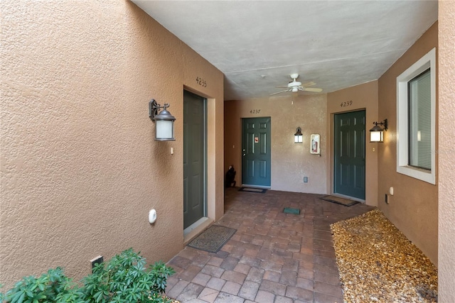 4235 Overture Cir Unit 4235, Bradenton, FL 34209 - doorway to property featuring stucco siding and a ceiling fan