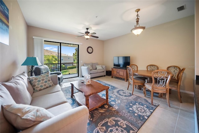 4235 Overture Cir Unit 4235, Bradenton, FL 34209 - living area featuring light tile patterned floors and ceiling fan