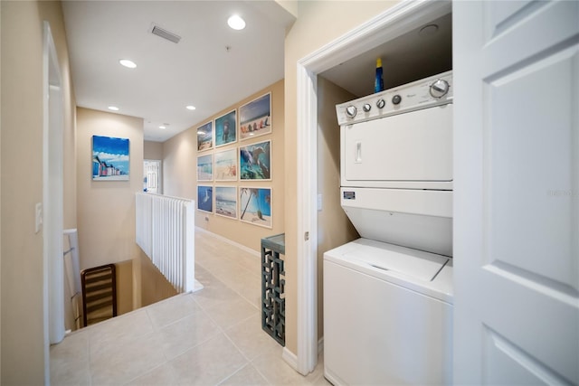4235 Overture Cir Unit 4235, Bradenton, FL 34209 - laundry room with estacked washer and dryer, light tile patterned floors, and recessed lighting