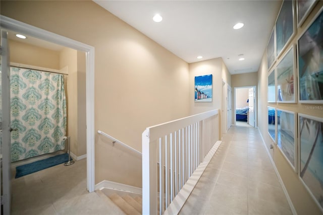 4235 Overture Cir Unit 4235, Bradenton, FL 34209 - hall with an upstairs landing, light tile patterned floors, and recessed lighting