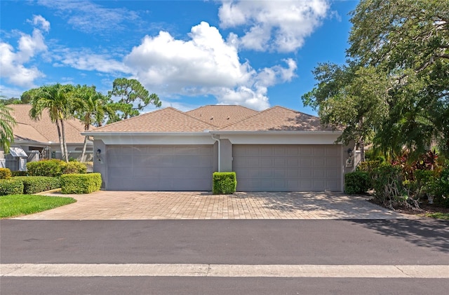 5417 Champagne Unit 63, Sarasota, FL 34235 - single story home featuring decorative driveway, an attached garage, and stucco siding