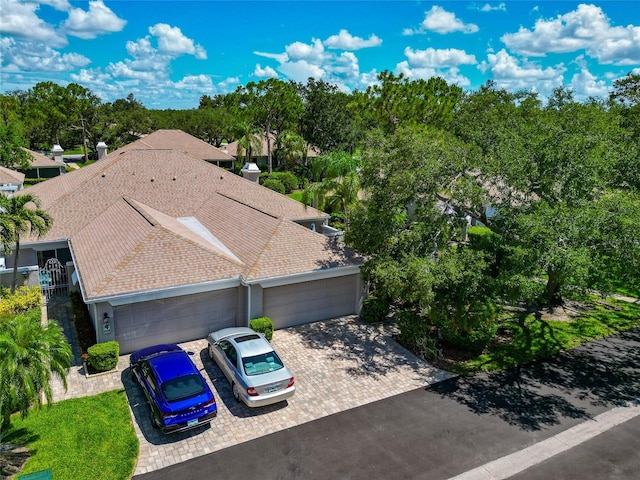 5417 Champagne Unit 63, Sarasota, FL 34235 - aerial view of property and surrounding area featuring a tree filled landscape