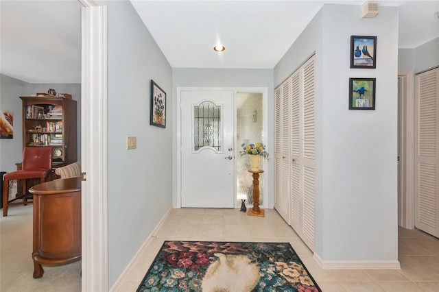 5417 Champagne Unit 63, Sarasota, FL 34235 - foyer entrance with light tile patterned floors and baseboards
