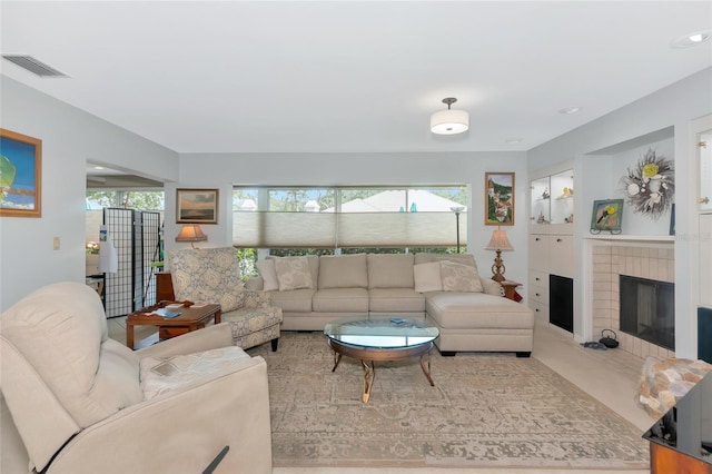 5417 Champagne Unit 63, Sarasota, FL 34235 - living room with a tile fireplace