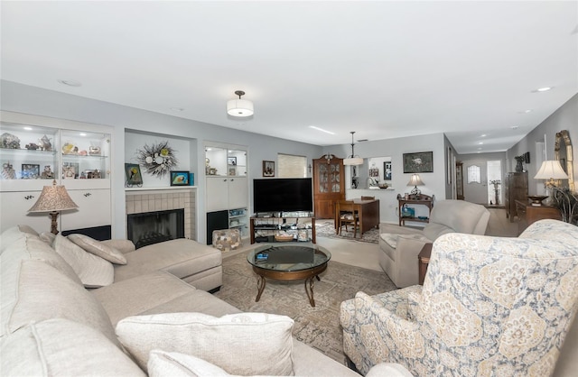 5417 Champagne Unit 63, Sarasota, FL 34235 - living area featuring a brick fireplace and recessed lighting