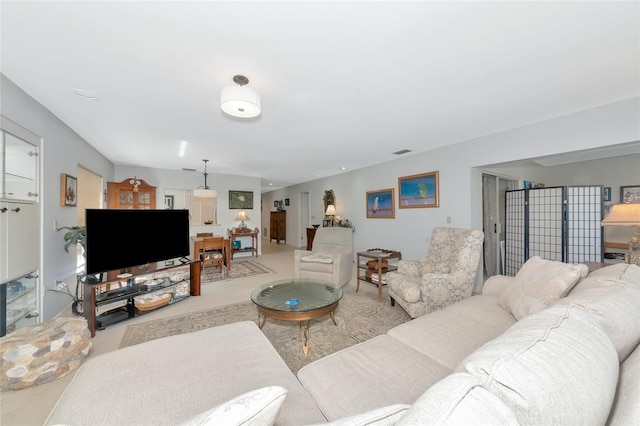 5417 Champagne Unit 63, Sarasota, FL 34235 - living room featuring carpet floors