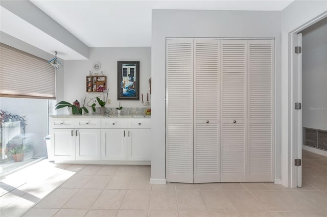 5417 Champagne Unit 63, Sarasota, FL 34235 - full bath with a closet, vanity, and tile patterned floors