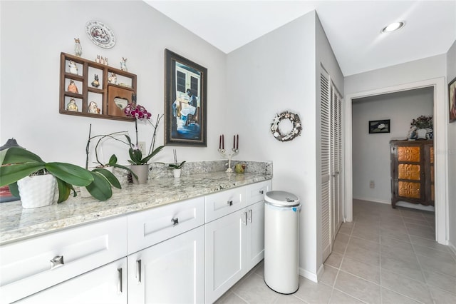 5417 Champagne Unit 63, Sarasota, FL 34235 - bar area with light tile patterned floors and baseboards