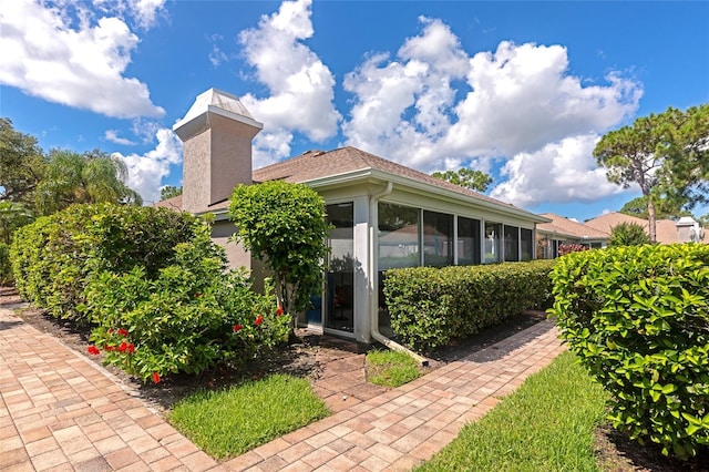 5417 Champagne Unit 63, Sarasota, FL 34235 - back of property with a chimney