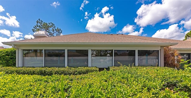 5417 Champagne Unit 63, Sarasota, FL 34235 - rear view of house with a chimney