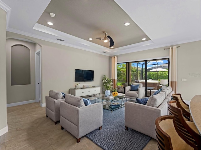 5364 Salcano St, Sarasota, FL 34238 - living room with a raised ceiling, ceiling fan, recessed lighting, crown molding, and arched walkways