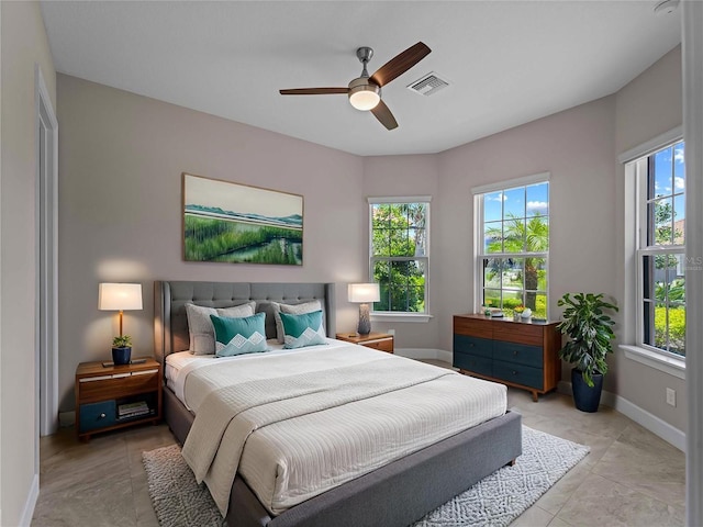 5364 Salcano St, Sarasota, FL 34238 - bedroom featuring multiple windows, ceiling fan, and light tile patterned flooring