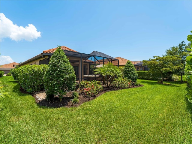 5364 Salcano St, Sarasota, FL 34238 - view of grassy yard featuring glass enclosure