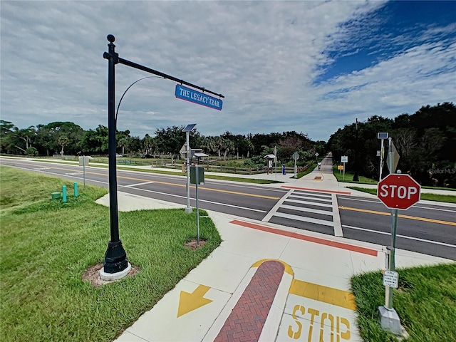 5364 Salcano St, Sarasota, FL 34238 - view of asphalt road with traffic signs, street lighting, and sidewalks
