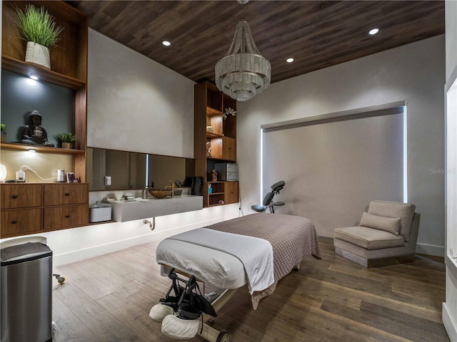 5364 Salcano St, Sarasota, FL 34238 - bedroom featuring wooden ceiling, dark wood-style flooring, recessed lighting, and a chandelier