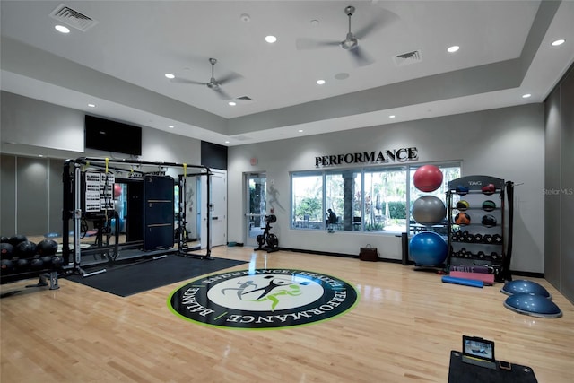 5364 Salcano St, Sarasota, FL 34238 - gym featuring ceiling fan, wood finished floors, recessed lighting, and a raised ceiling