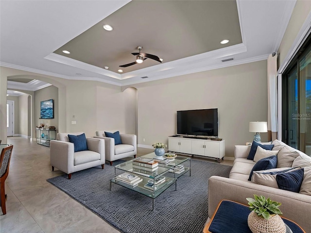 5364 Salcano St, Sarasota, FL 34238 - living area with arched walkways, a raised ceiling, ceiling fan, recessed lighting, and ornamental molding