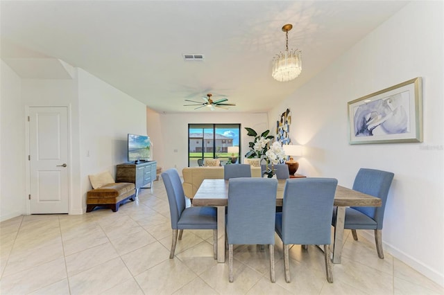 15164 Sunny Day Dr, Bradenton, FL 34211 - dining room featuring a ceiling fan, light tile patterned floors, and a chandelier