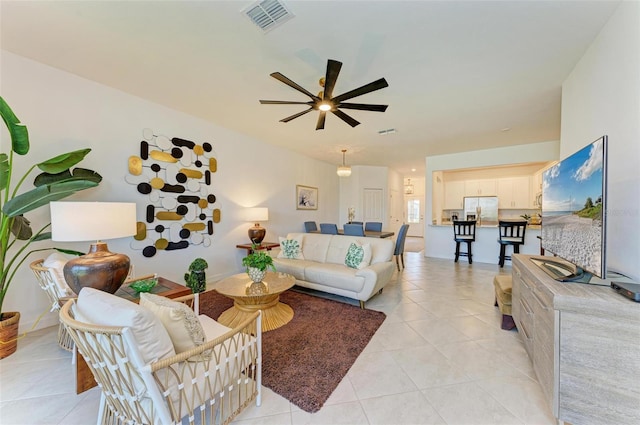 15164 Sunny Day Dr, Bradenton, FL 34211 - living room featuring ceiling fan and light tile patterned flooring