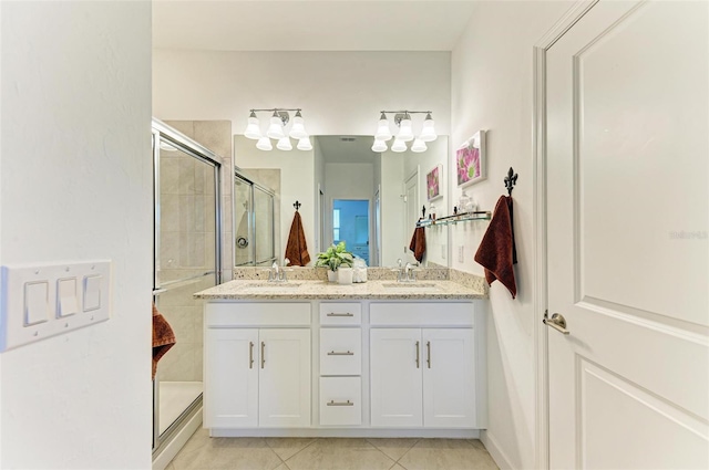 15164 Sunny Day Dr, Bradenton, FL 34211 - full bathroom with a stall shower, double vanity, and tile patterned flooring