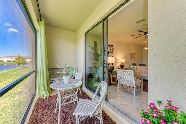 15164 Sunny Day Dr, Bradenton, FL 34211 - sunroom with a ceiling fan and a water view