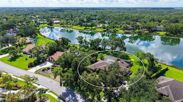 7426 Weeping Willow Blvd, Sarasota, FL 34241 - aerial perspective of suburban area with a nearby body of water and a heavily wooded area
