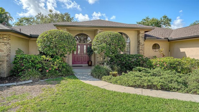 7426 Weeping Willow Blvd, Sarasota, FL 34241 - view of front of home with a front yard and stucco siding