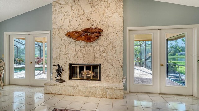 7426 Weeping Willow Blvd, Sarasota, FL 34241 - unfurnished living room with french doors, lofted ceiling, and tile patterned flooring