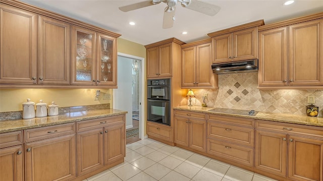 7426 Weeping Willow Blvd, Sarasota, FL 34241 - kitchen with black appliances, under cabinet range hood, brown cabinetry, backsplash, and recessed lighting
