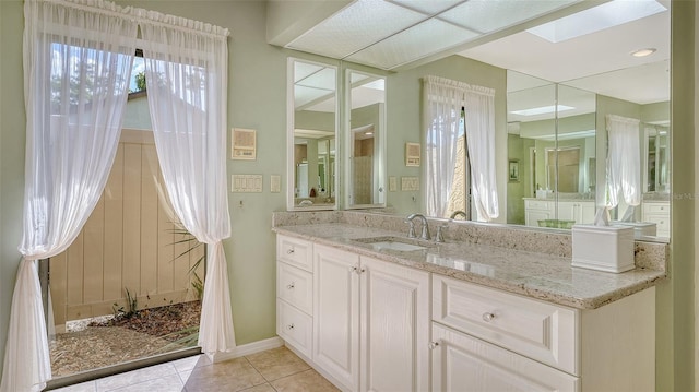 7426 Weeping Willow Blvd, Sarasota, FL 34241 - full bathroom with vanity, tile patterned floors, and a skylight