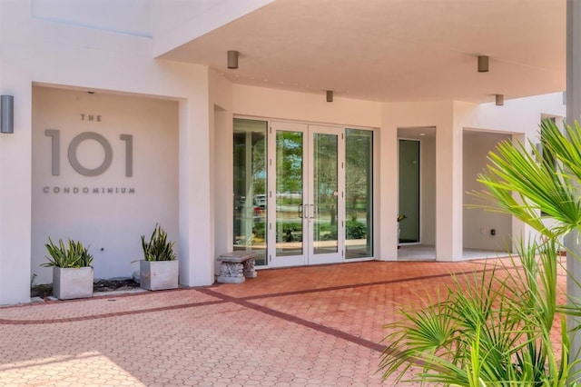 101 S Gulfstream Ave Unit 15C, Sarasota, FL 34236 - view of exterior entry featuring french doors and stucco siding