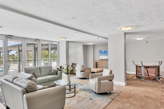 101 S Gulfstream Ave Unit 15C, Sarasota, FL 34236 - living area featuring brick patterned flooring and baseboards