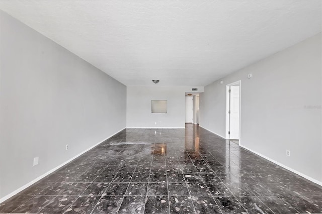101 S Gulfstream Ave Unit 15C, Sarasota, FL 34236 - unfurnished living room featuring baseboards