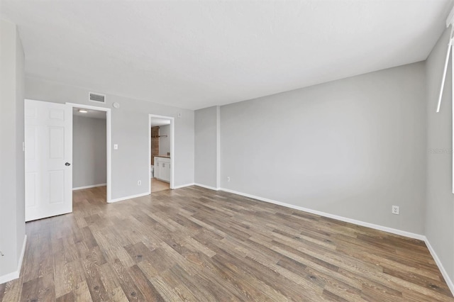 101 S Gulfstream Ave Unit 15C, Sarasota, FL 34236 - empty room featuring wood finished floors and baseboards