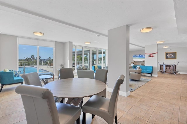 101 S Gulfstream Ave Unit 15C, Sarasota, FL 34236 - dining space featuring baseboards and brick patterned flooring
