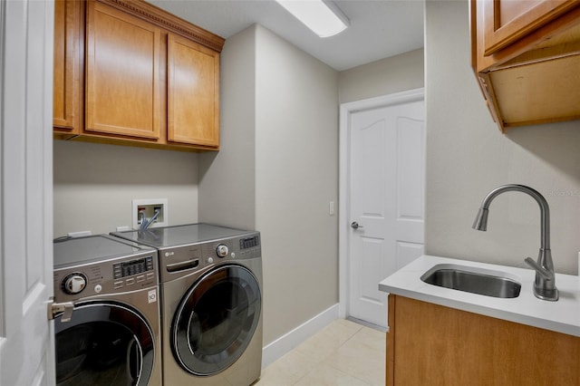 2761 Feiffer Cir, Sarasota, FL 34235 - washroom featuring cabinet space, washing machine and clothes dryer, and light tile patterned flooring