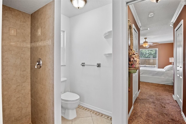 2761 Feiffer Cir, Sarasota, FL 34235 - ensuite bathroom with a tile shower, a textured ceiling, and tile patterned flooring