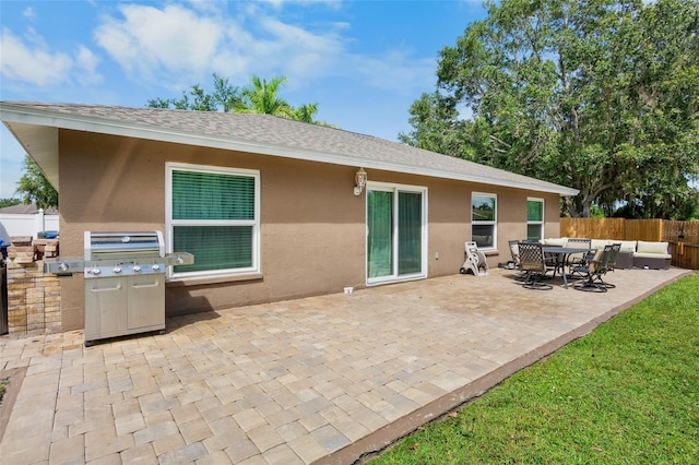 2761 Feiffer Cir, Sarasota, FL 34235 - back of property with stucco siding, a patio, roof with shingles, and outdoor dining space