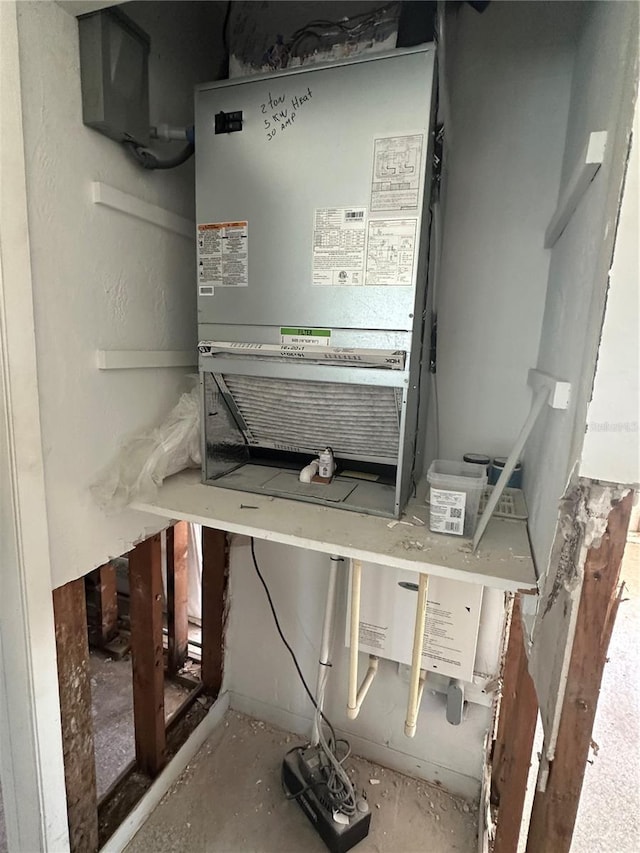 13434 1st St E, Madeira Beach, FL 33708 - utility room with heating unit