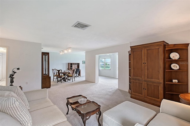 3641 Somerville Dr Unit 1506, Sarasota, FL 34232 - living area featuring light carpet and rail lighting
