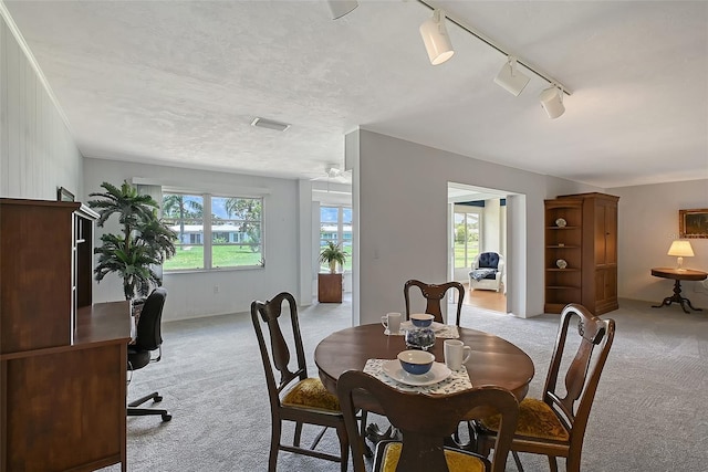 3641 Somerville Dr Unit 1506, Sarasota, FL 34232 - dining room featuring light colored carpet, a desk, and a ceiling fan