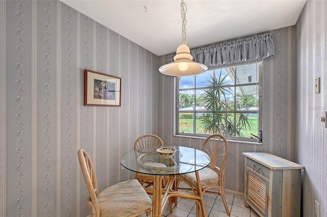 3641 Somerville Dr Unit 1506, Sarasota, FL 34232 - dining room featuring light tile patterned floors and wallpapered walls