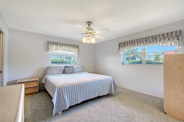 3641 Somerville Dr Unit 1506, Sarasota, FL 34232 - bedroom with multiple windows, carpet flooring, and a ceiling fan