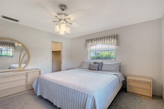 3641 Somerville Dr Unit 1506, Sarasota, FL 34232 - bedroom with light colored carpet, a ceiling fan, and a spacious closet