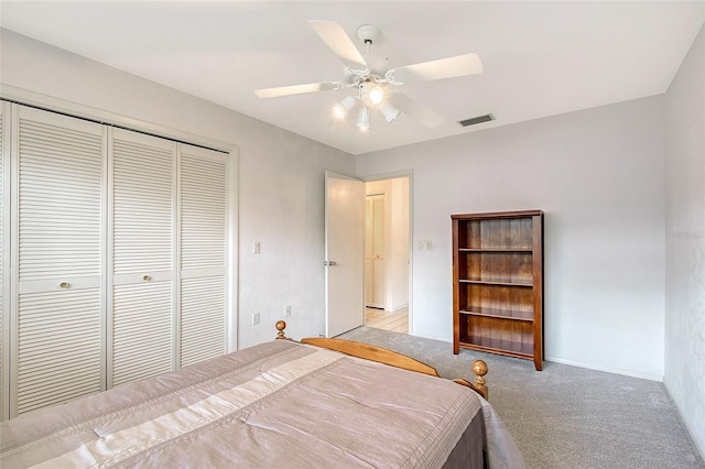 3641 Somerville Dr Unit 1506, Sarasota, FL 34232 - bedroom with a closet, light carpet, and ceiling fan